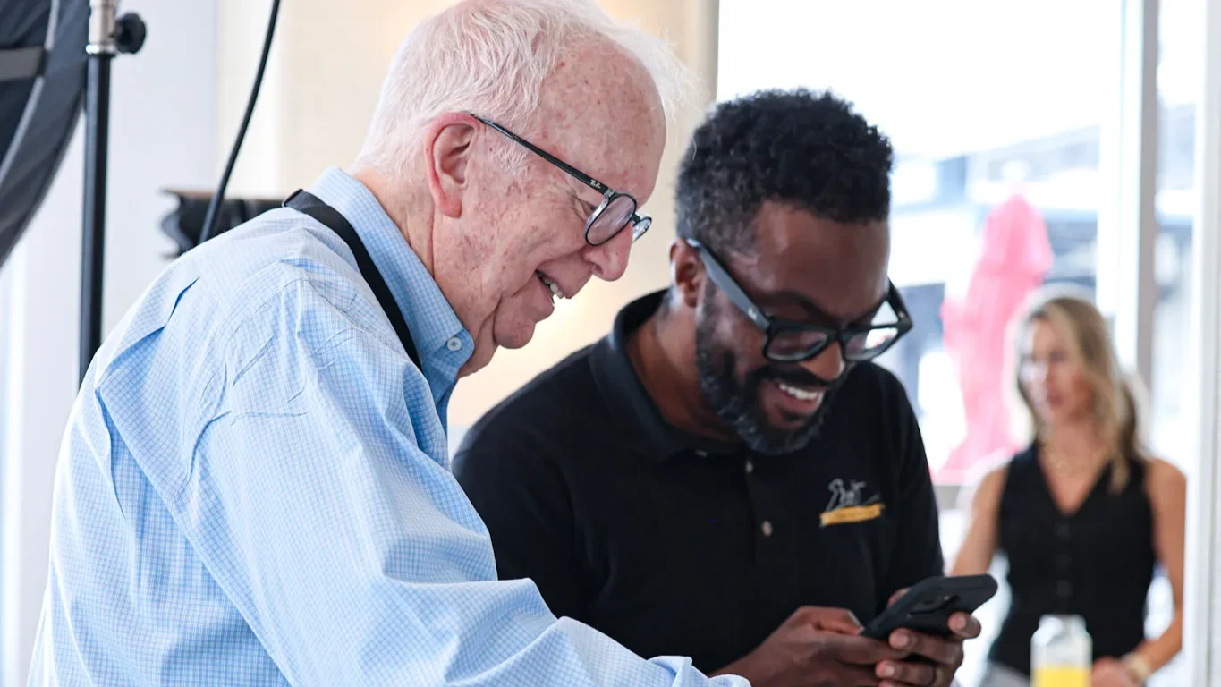 An attendee signing up for their headshot with Errol from Errol E Photography.