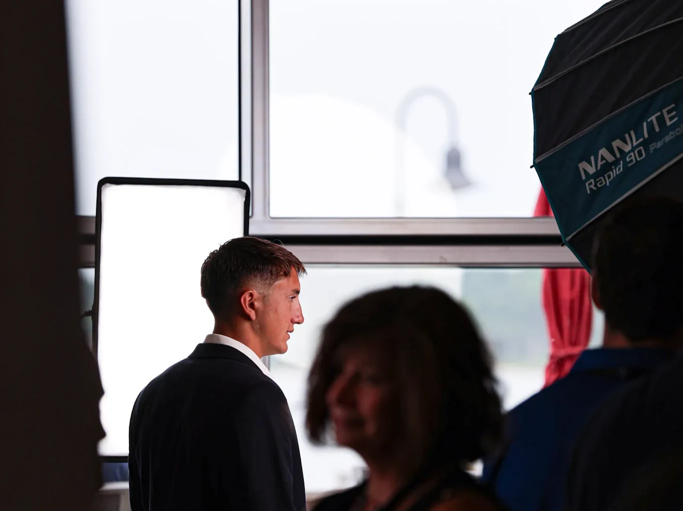 A headshot station set up at a Delaware conference with a photographer working with an attendee