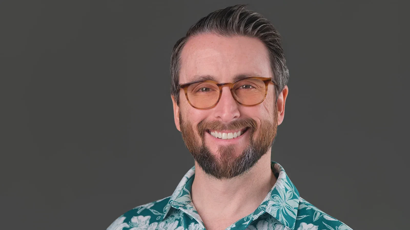 A professional headshot by Errol E Photography.